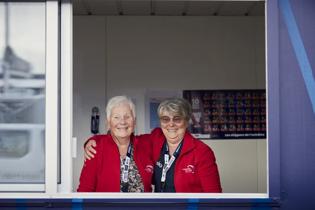 LES SABLES D'OLONNE, FRANCE - NOVEMBER 2, 2024: Volunteers are photographed at the accreditation center during prestart of the Vendee Globe, on November 2, 2024 in Les Sables d'Olonne, France - (Photo by Anne Beauge / Alea)

Giselle and Claudette, known as "the Claudettes", are inseparable. Since 2012 they have been present at the Vendée Globe, and most of the time at the ticket office.